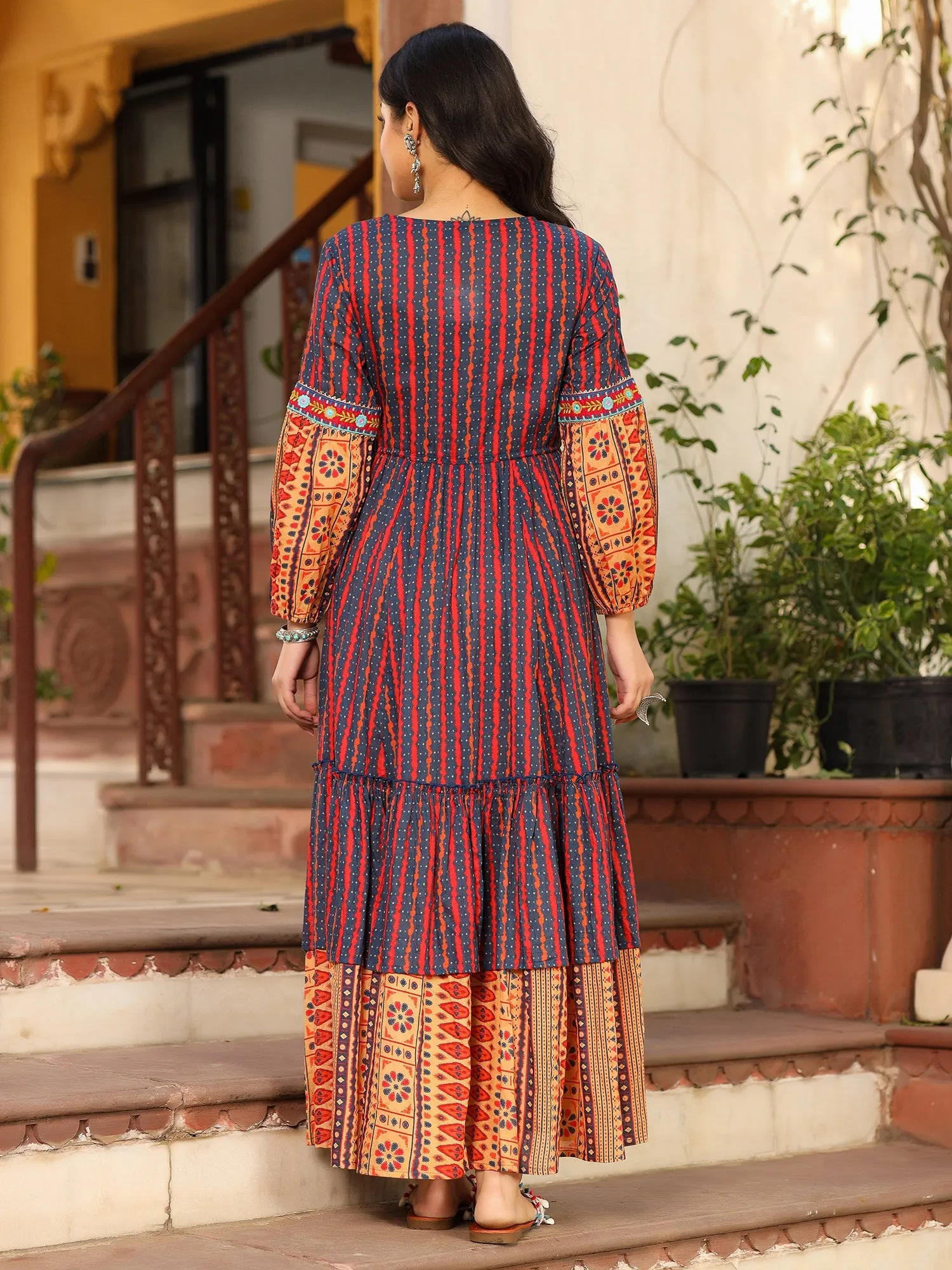 Jashvi Rust Ikat Cotton Printed Tiered Maxi Dress With Thread Embroidery & Dori Tassel Tie-Up At Waist