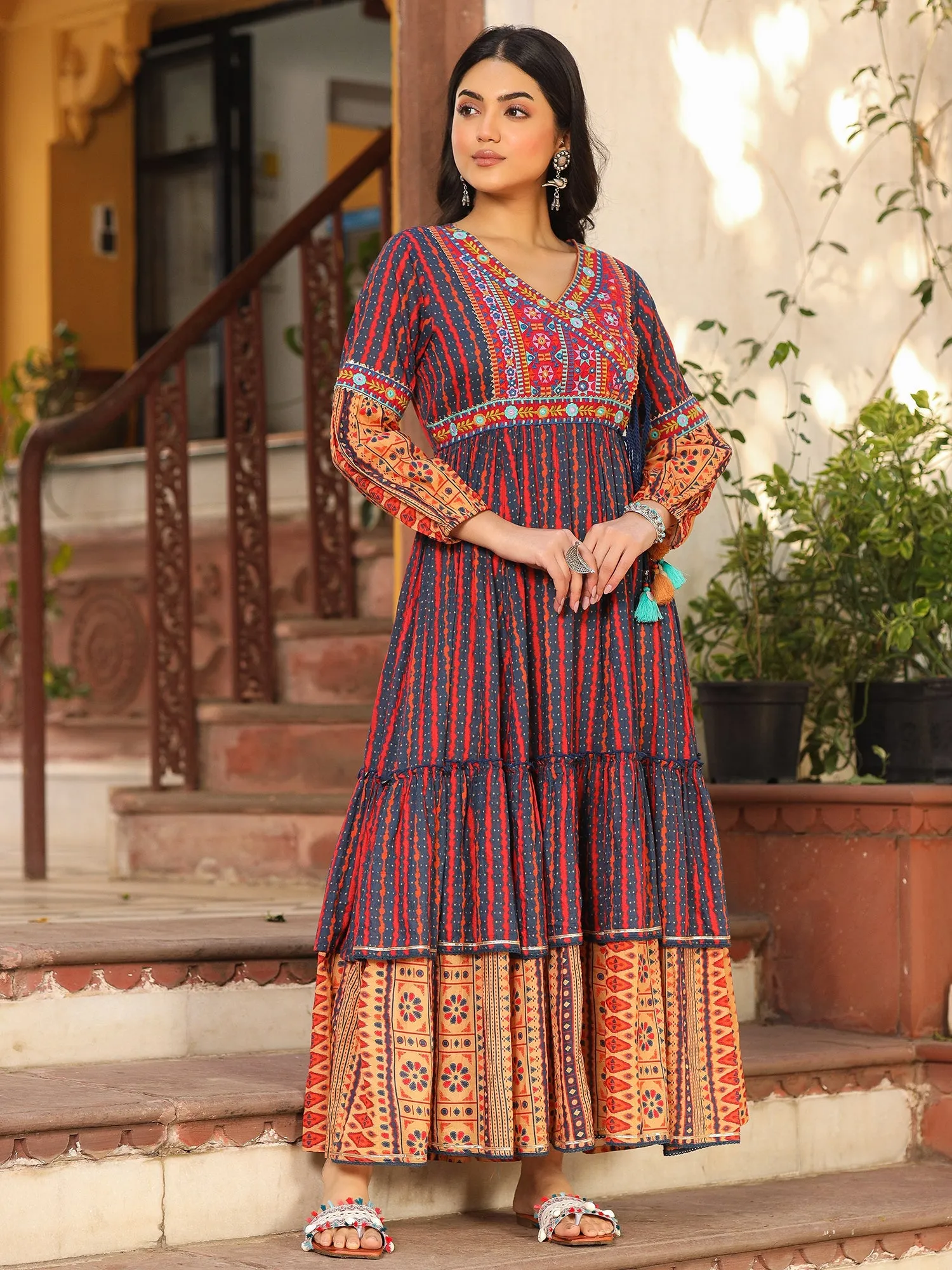 Jashvi Rust Ikat Cotton Printed Tiered Maxi Dress With Thread Embroidery & Dori Tassel Tie-Up At Waist